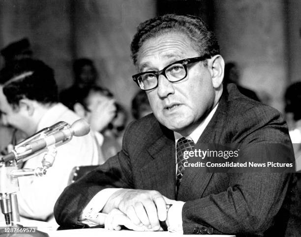View of US National Security Advisor and Secretary of State-designate Henry Kissinger as he testifies during his confirmation hearing before the...