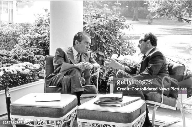 President Richard Nixon meets with National Security Advisor, Henry Kissinger on the Colonnade outside the White House's Oval Office, Washington DC,...