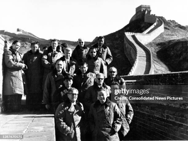 Members of the US delegations pose with Chinese hosts on Great Wall of China, China, October 22, 1971. Pictured are, front row, from left, US...