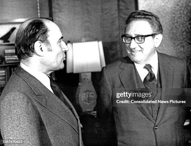 French Socialist leader Francois Mitterrand and US Secretary of State Henry Kissinger talk in the latter's office at the State Department, Washington...