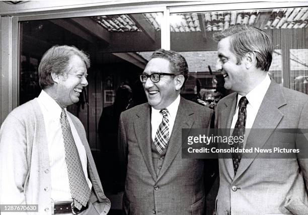 View of, from left, US President-elect Jimmy Carter, US Secretary of State Henry Kissinger, and Vice President-elect Walter Mondale as they meet for...