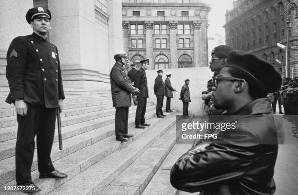 New York Police Department officers stand on the steps of the Foley Square Courthouse during a demonstration by the Black Panthers, in Foley Square,...