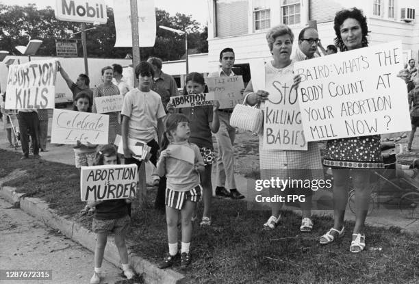 An anti-abortion picket, with protestors holding placards, a birth control lecture by reproductive rights advocate Bill Baird, United States, 13th...