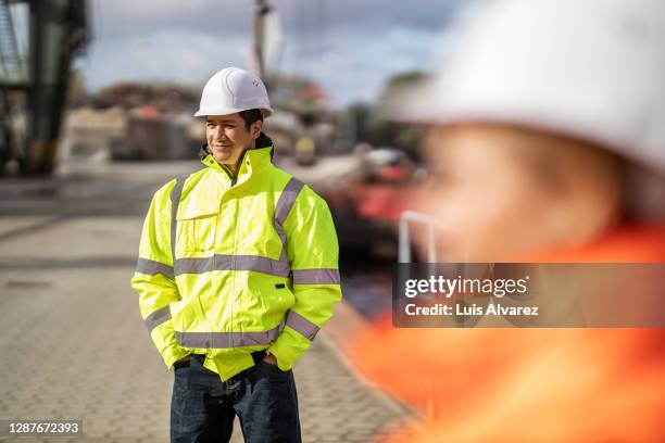 commercial dock engineer standing in meeting - shipyard stock-fotos und bilder