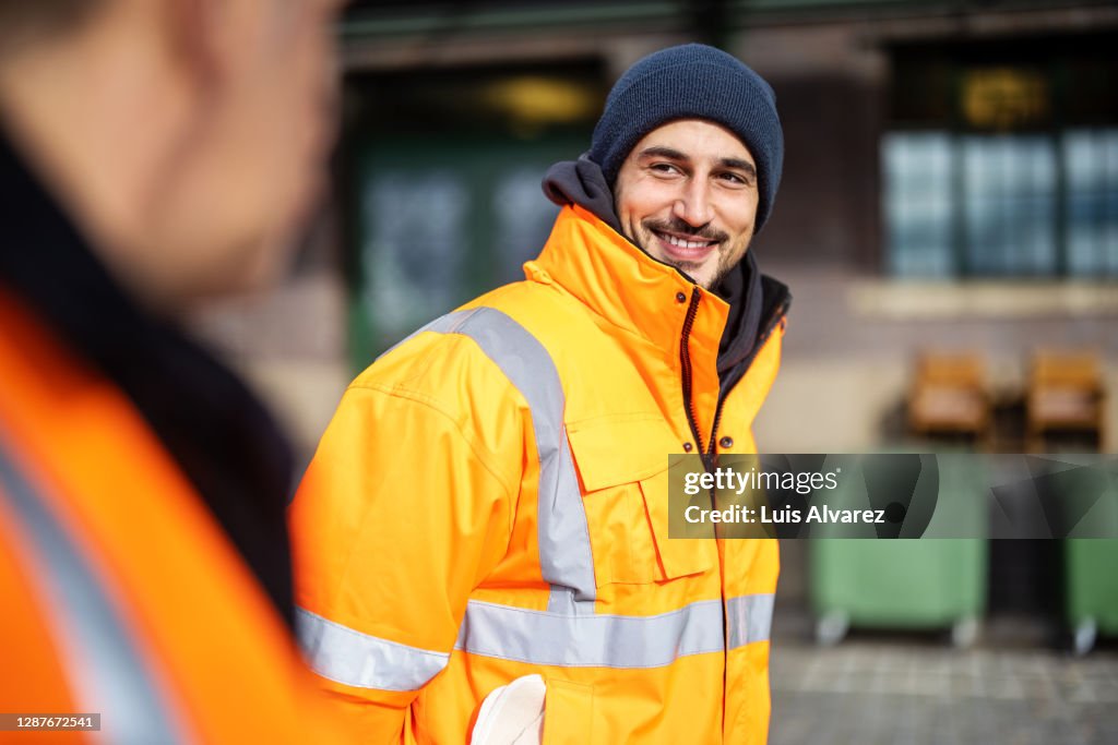 Happy young man working at warerhouse