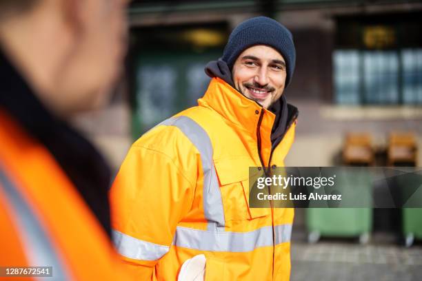 happy young man working at warerhouse - dockers stockfoto's en -beelden