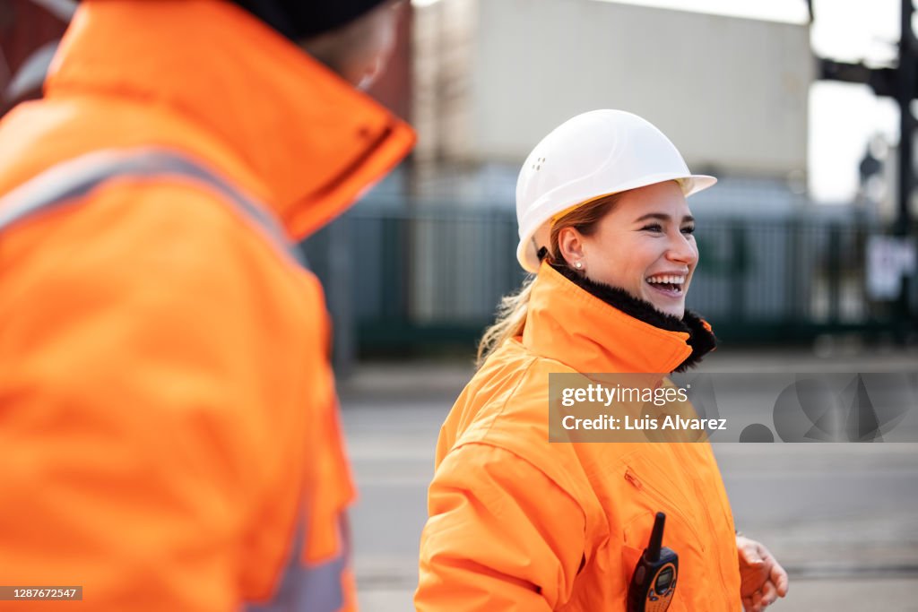 Smiling female engineer at the shipyard