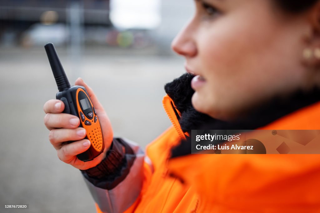Engineer reporting via walkie-talkie
