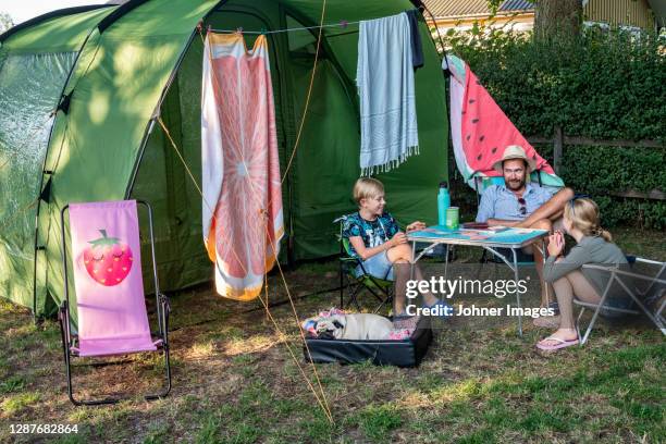 father with children in front of tent - the comedy tent stock pictures, royalty-free photos & images