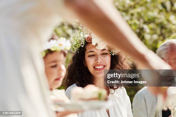 smiling woman sitting at table - coffee break party stock-fotos und bilder