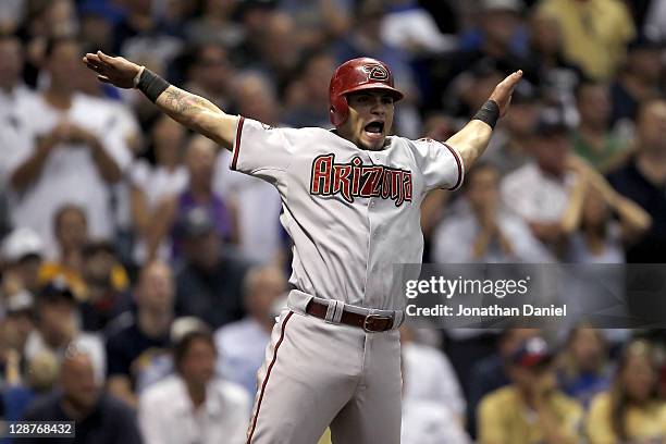 Gerardo Parra of the Arizona Diamondbacks reacts after scoring the game-tying run in the ninth inning on a bunt single by Willie Bloomquist off...