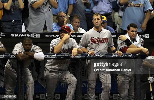 Justin Upton, Ian Kennedy, Willie Bloomquist and Paul Goldschmidt of the Arizona Diamondbacks stand at the top of the dugout while taking on the...