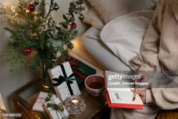 womans hands holding diary - johner christmas foto e immagini stock