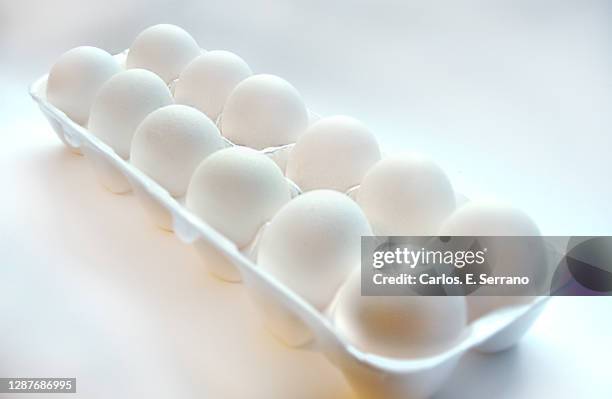 a dozen white eggs - dozen eggs stock pictures, royalty-free photos & images