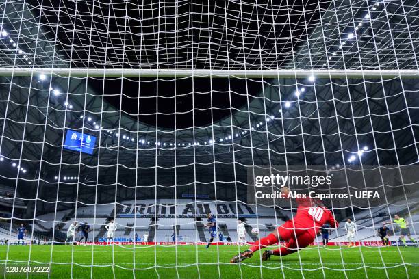 Sergio Oliveira of FC Porto scores their team's second goal from the penalty spot past Steve Mandanda of Marseille during the UEFA Champions League...