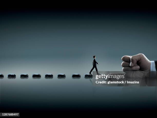 stepping stone, stone, lake, contrast, man, oriental, full body, walk, profile, hand, promise - man side view stock pictures, royalty-free photos & images