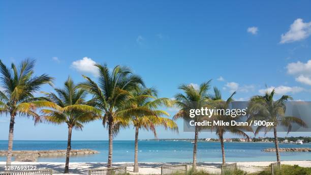 scenic view of sea against sky,nassau,bahamas - nassau beach stock pictures, royalty-free photos & images