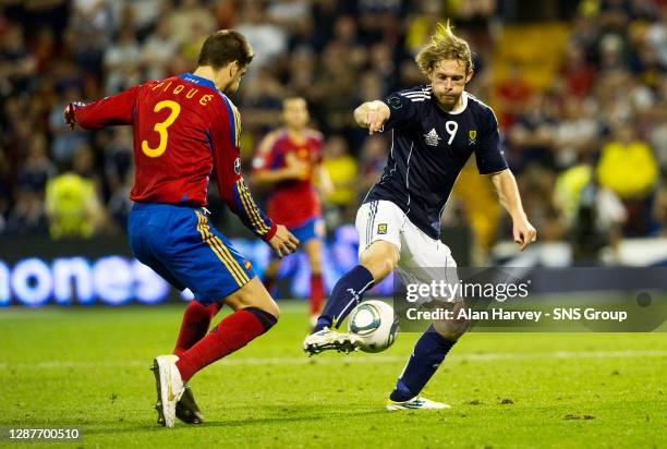 V SCOTLAND .ESTADIO JOSE RICO PEREZ - ALICANTE .Spain's Craig Mackail-Smith is kept in check by Gerard Pique.