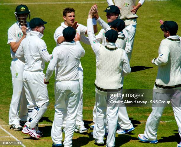 Australia's James Pattison celebrates with team mates after bowling out Moneeb Iqbal.