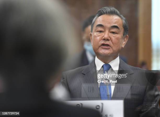Chinese Foreign Minister Wang Yi talks with South Korea Foreign Minister Kang Kyung-wha during their meeting at foreign ministry on November 26, 2020...