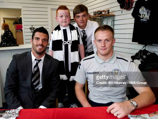 St Mirren's Lewis Guy , Grant Adam and Thomas Reilly are all smiles as they sign autographs for fans in the club shop before kick-off.