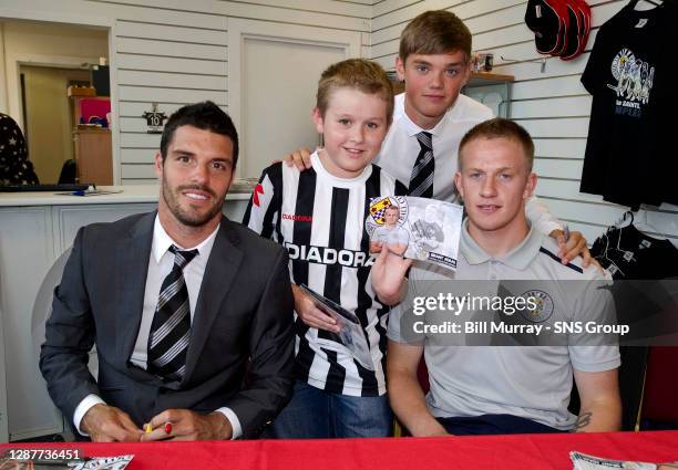 St Mirren's Lewis Guy , Grant Adam and Thomas Reilly are all smiles as they sign autographs for fans in the club shop before kick-off.