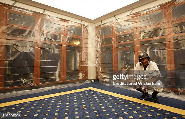 Nyjer Morgan of the Milwaukee Brewers has a moment to himself in the clubhouse following their win against the Arizona Diamondbacks in Game Five of...