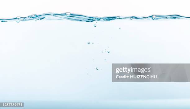 water wave, transparent surface with bubbles - water surface fotografías e imágenes de stock