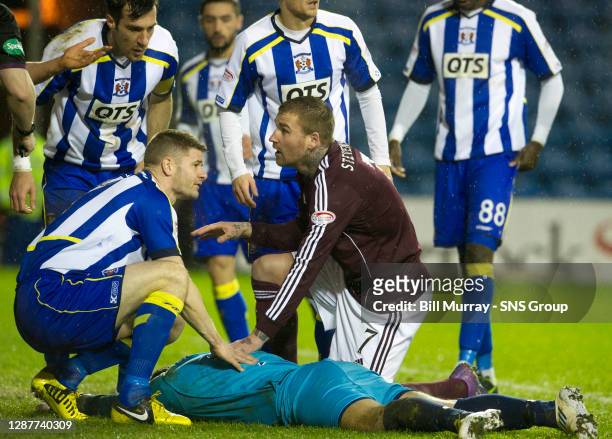 V HEARTS .RUGBY PARK - KILMARNOCK.Michael Nelson and Ryan Stevenson check on Kilmarnock keeper Cammy Bell after a challenge with John Sutton
