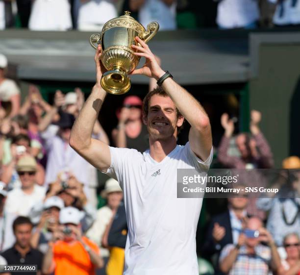 Novak DJOKOVIC Andy MURRAY .WIMBLEDON - LONDON.Andy Murray lifts the Wimbledon trophy after a straight sets victory over Novak Djokovic.