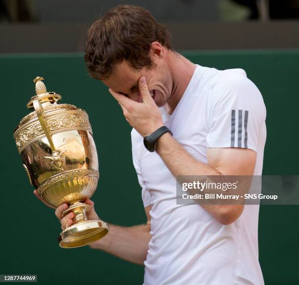 Novak DJOKOVIC Andy MURRAY .WIMBLEDON - LONDON.An emotional Andy Murray celebrates with the WImbledon trophy after victory in the final over Novak...