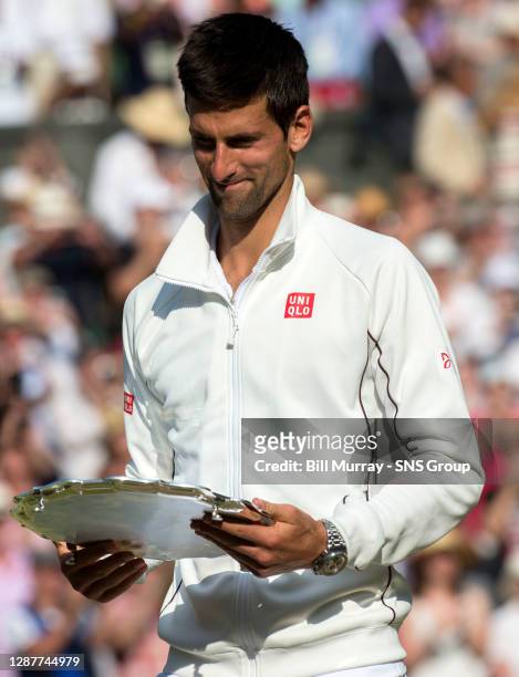 Novak DJOKOVIC Andy MURRAY .WIMBLEDON - LONDON.Novak Djokovic leaves centre court after defeat in the Wimbledon final against Andy Murray.