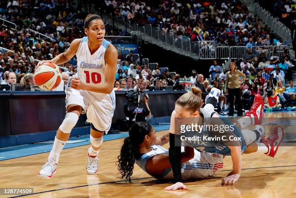 Lindsay Whalen of the Minnesota Lynx knocks down Angel McCoughtry of the Atlanta Dream while defending Lindsey Harding in Game Three of the 2011 WNBA...