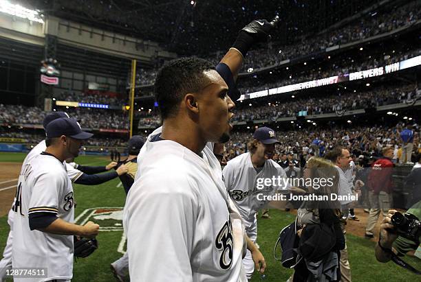 Carlos Gomez of the Milwaukee Brewers celebrates after the Brewers defeat the Arizona Diamondbacks in Game Five of the National League Division...