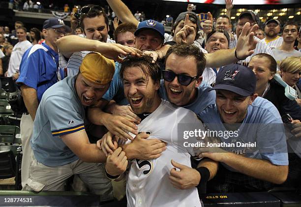 Taylor Green of the Milwaukee Brewers celebrates with the fans after the Brewers 3-2 10 inning victory against the Arizona Diamondbacks in Game Five...