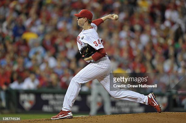 Roy Halladay of the Philadelphia Phillies throws a pitch against the St. Louis Cardinals during Game Five of the National League Divisional Series at...