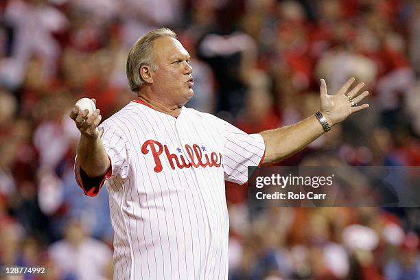 Former Philadelphia Phillies player Greg "the Bull" Luzinski acknowledges the fans before throwing out the ceremonial first pitch against the St....