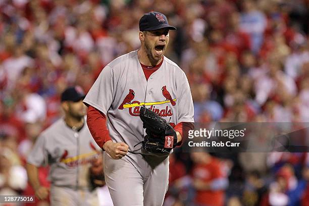 Chris Carpenter of the St. Louis Cardinals reacts after he caught a line drive hit by Jimmy Rollins of the Philadelphia Phillies for the final out in...