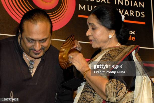 Leslie Lewis and Asha Bhosle attend the Global Indian Music Awards 2010 announcement on November 02, 2010 in Mumbai, India.