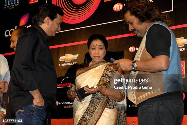 Lalit Pandi, Asha Bhosle and Hariharan attend the Global Indian Music Awards 2010 announcement on November 02, 2010 in Mumbai, India.