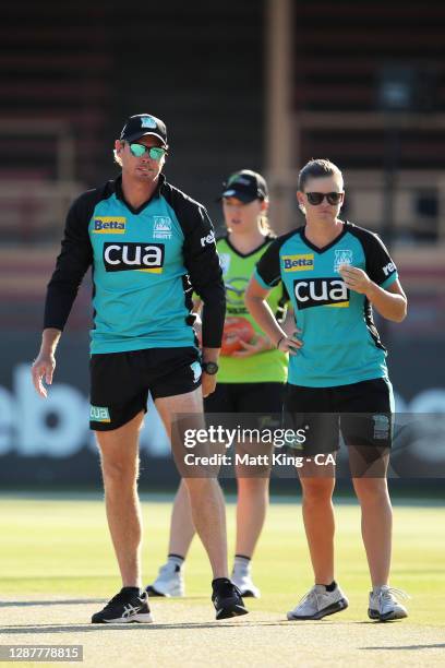 Heat head coach Ashley Noffke and captain Jess Jonassen inspect the pitch before the Women's Big Bash League WBBL Semi Final match between the...