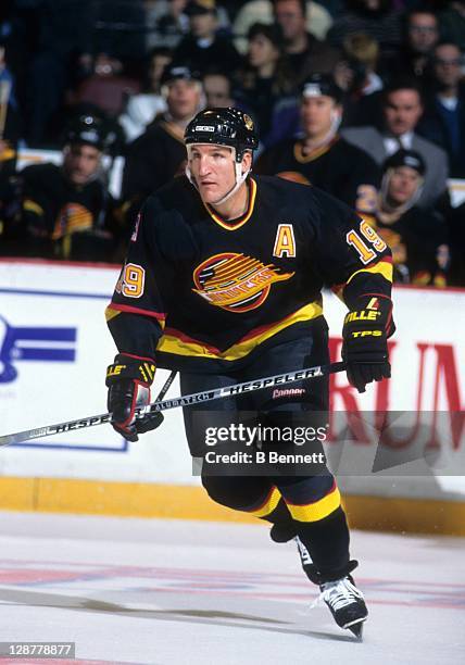 Tim Hunter of the Vancouver Canucks skates on the ice during an NHL game against the Philadelphia Flyers on November 19, 1995 at the Spectrum in...