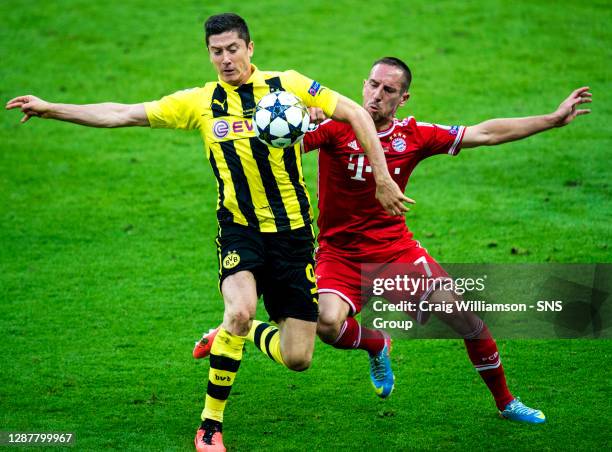 Borussia Dortmund's Robert Lewandowski and Franck Ribery battle for possession.