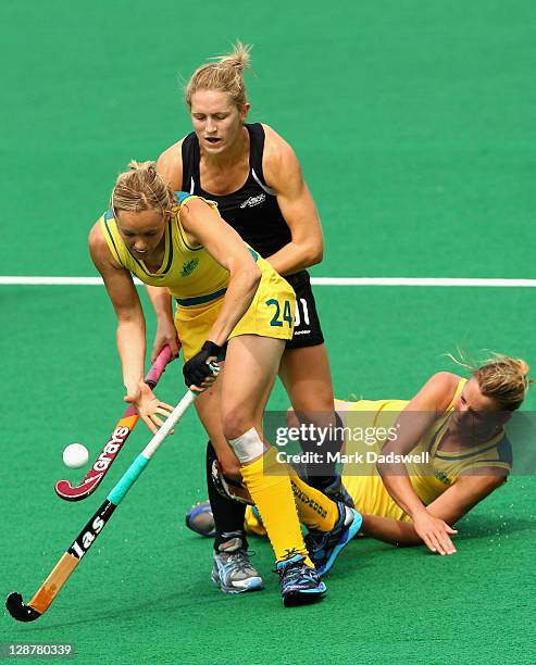 Fiona Boyce of the Hockeyroos wins the ball from Stacey Michelsen of the Blacksticks during the Oceania Cup match between New Zealand and Australia...