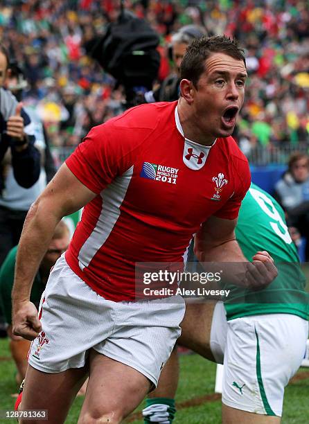 Wing Shane Williams of Wales celebrates after scoring the opening try of the match during quarter final one of the 2011 IRB Rugby World Cup between...