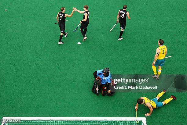 New Zealand Blacksticks players Blair Hilton and Stephen Jenness celebrate a goal during the Oceania Cup match between Australia and New Zealand at...