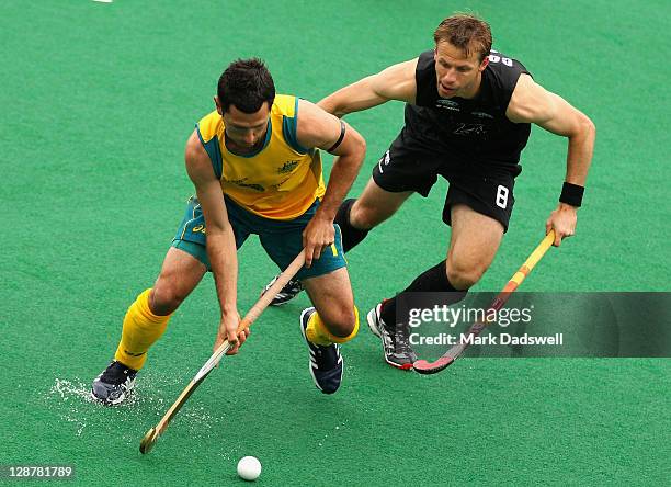 Jamie Dwyer of the Kookaburras competes with Dean Couzins of the Blacksticks during the Oceania Cup match between Australia and New Zealand at Hobart...