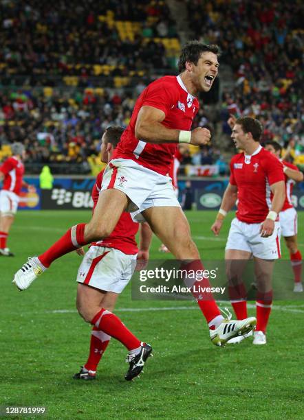 Scrumhalf Mike Phillips of Wales celebrates his team's 22-10 victory as the final whistle blows during quarter final one of the 2011 IRB Rugby World...