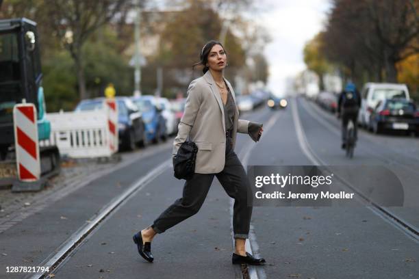 Masha Sedgwick wearing Pepe Jeans x dua Lipa black jeans, Bite blouse, Designers Remix blazer, Zara hair cuf, Bottega Veneta bag and Maison Margiela...