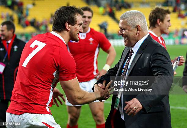 Warren Gatland the head coach of Wales celebrates with his captain Sam Warburton of Wales following their team's 22-10 victory during quarter final...